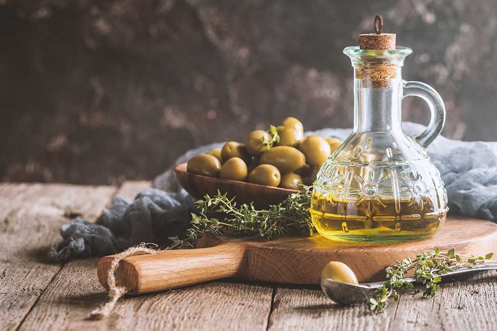 Olive oil and bowl of olives