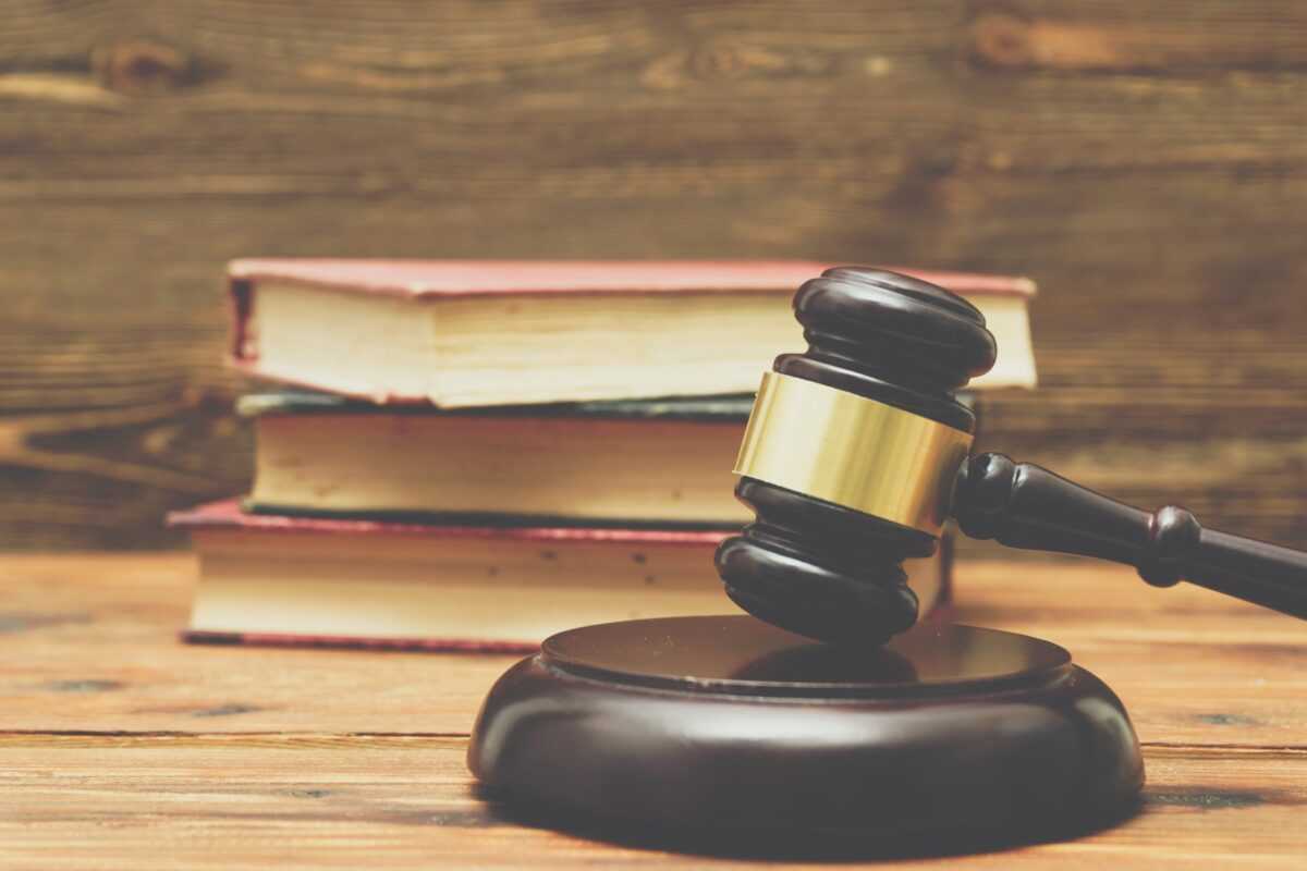 gavel and law books on a wooden background PTC53CR min scaled