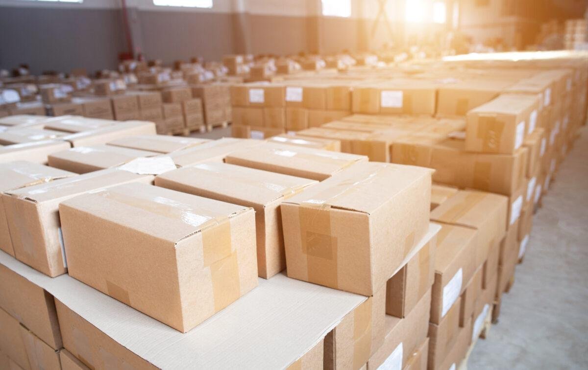 A lot of cardboard boxes in stock Detention of smuggled goods at customs The concept of illegal crossing of cigarette and alcohol products, sunset