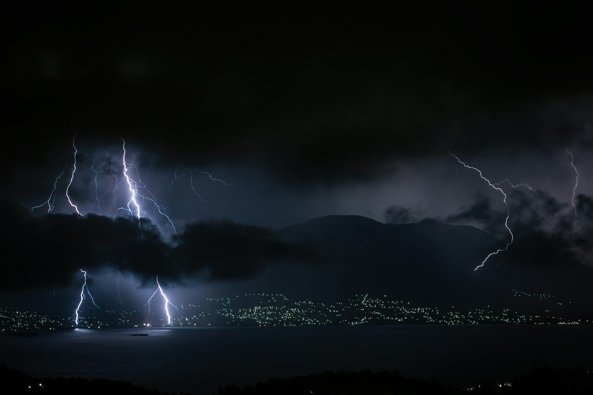 lightning strike on mountain during night time