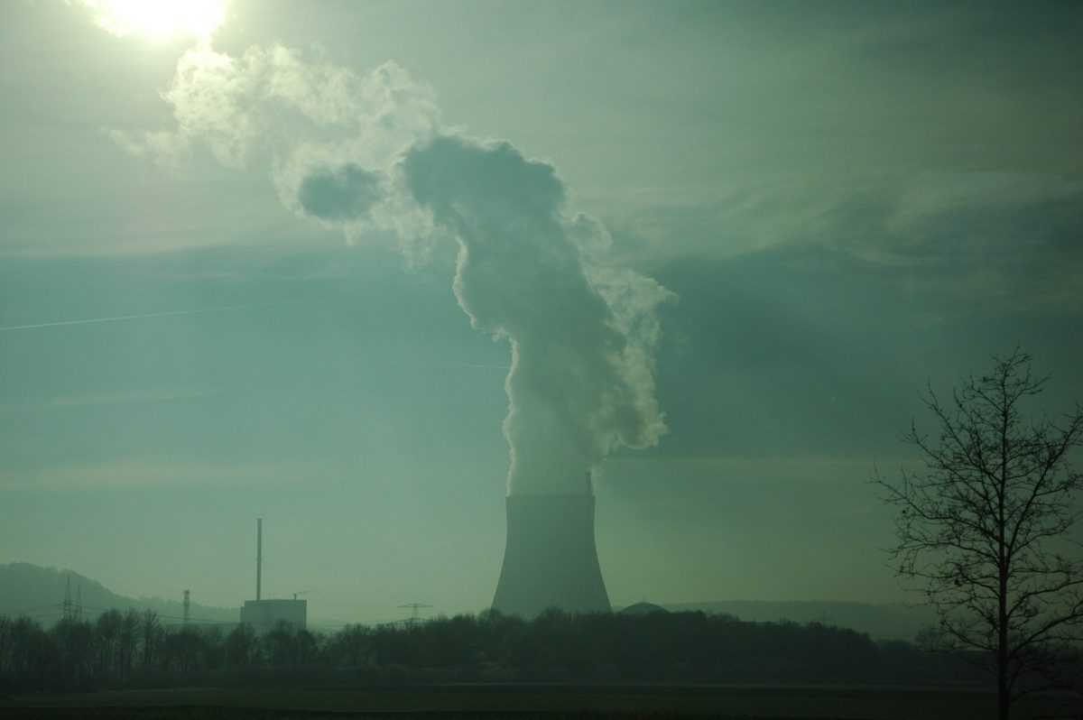 mountain white white smoke under white and blue skies during daytime