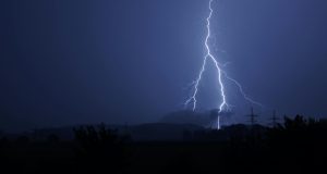 Dramatic lightning bolt striking during a stormy night. Perfect for nature and weather themes.