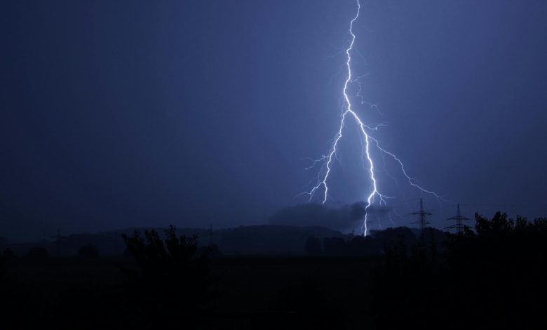 Dramatic lightning bolt striking during a stormy night. Perfect for nature and weather themes.