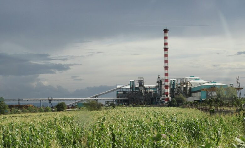 a factory with a large pipe sticking out of it's side