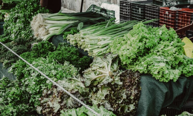 green vegetable on black plastic basket