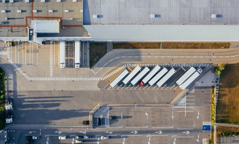 production, facility, logistic, distribution center, transit, truck, transport, top view, industrial, semi, aerial view, heavy, depot, germany, warehouse, container truck, shipping containers, storehouse, road, loading bay, factory, unloading, distribute, unload, europe, aerial photography, production, logistic, truck, truck, warehouse, warehouse, warehouse, warehouse, warehouse