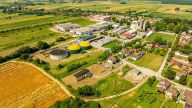 Aerial shot of Hercegovac, Croatia, showing industrial and agricultural landscape.