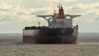 a large cargo ship in the middle of the ocean