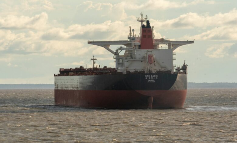 a large cargo ship in the middle of the ocean