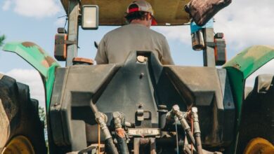man riding tractor