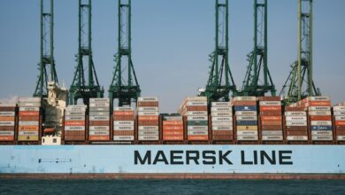 cargo ship on body of water during daytime